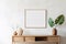 Empty mock up poster frame on white stucco wall above wooden cabinet