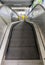 The empty modern escalator that is not yet in operation inside the suburban train station