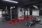 An empty modern gymnasium with a variety of equipment, offering a spacious, functional, and well-equipped training