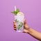 Empty Mojito Mockup With Nurse Hand Holding Drink On Purple Background