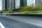 Empty motion blurred asphalt road and modern office buildings.