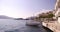 An empty motor boat is tied to the quay on the embankment