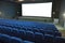 Empty movie cinema with raws of blue seats