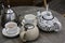 Empty mugs and a teapot on the table