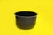 Empty multi cooker bowl on yellow background