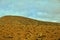 Empty mysterious mountainous landscape from the center of the Canary Island Spanish Fuerteventura with a cloudy sky