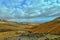 Empty mysterious mountainous landscape from the center of the Canary Island Spanish Fuerteventura with a cloudy sky