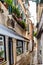 Empty narrow alleyway brick/cobblestone street in Venice, Italy