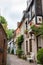 Empty narrow street with medieval houses. Cozy street in old town, Europe. Beautiful exterior of european old buildings.