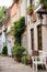 Empty narrow street with medieval houses. Cozy street in old town, Europe. Beautiful exterior of european old buildings.