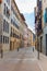 Empty narrow street in old town, Spain. Traditional facade of buildings in small town in Europe.