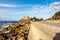 Empty national route 249 along Sosogi coastline on Noto Peninsula, Japan, with scenic sea view and rocks.