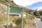 Empty natural green sign in wilderness Cape Town, South Africa