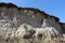 Empty nests, burrows of birds in the sand cliffs. Numerous holes of nests of swallows or swifts in the sandy slope