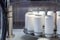 Empty new white aluminum cans for drink process are scanning and moving in factory line on conveyor belt machine at beverage