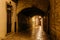 Empty night narrow European street with archway in the center of Sibenik, Croatia