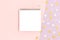 Empty notepad mockup on a pink pastel background. Stars confetti texture