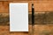 Empty office notebook and pen on a wooden board. Top view, high resolution photography - business concept.