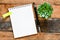 Empty office notebook and pen on a wooden board. Top view, high resolution photography - business concept.