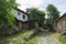 Empty old medieval path on antique residential village in past eastern europe town. Bulgarian small village alley