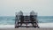 Empty old rusty pier on sea. Iron pier against sea waves and sandy beach. Old pier with rusty iron poles. Seascape