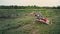 Empty old stroller in a field against the sky, an inverted baby carriage without a child