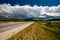 Empty open highway and stormy clouds in Wyoming