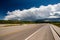 Empty open highway and stormy clouds in Wyoming