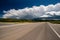 Empty open highway and stormy clouds in Wyoming