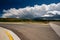 Empty open highway and stormy clouds in Wyoming