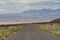 Empty open road in Nevada approaching Mountains