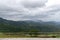 Empty outdoor balcony or terrace with mountain background.