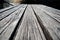 Empty outdoor rustic wooden table surface close up in a park