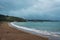 Empty overcast beach just before the rainfall. Gloomy day at Paihia Beach