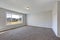 Empty pale grey room interior with carpet floor.