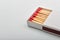 Empty paper matchbox with wooden matches on it. Matchbook case p