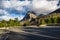 An empty parking lot in the Glacier National Park, with heavy clouds touching the mountain peak