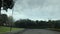 Empty parking lot under cloudy sky - time lapse