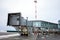 Empty passenger air bridge at the winter airport apron