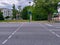 Empty pedestrian crossing with traffic light displaying red color