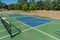 Empty Pickleball court blue and green recreational sport at an outdoor park