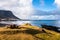 Empty Picnic Table on a Grassy Clifftop overlooking a Beautiful Bay in Iceland in Autumn