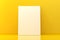 Empty picture frame canvas mock-up leaning against yellow wall in room with yellow reflective floor with copy space - portfolio