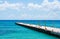Empty pier for ferries on blue Caribbean sea.