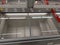 Empty pizza freezer cabinets in supermarket after panic buying due to outbreaking coronavirus