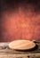 Empty pizza round board old wooden table and colour blurred bac