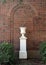 Empty planter on a pedestal outside Mount Auburn School in Dallas, Texas.