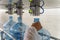 Empty plastic bottles or gallons on conveyor belt machinery equipment for checking plastic integrity and hardness in