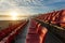 Empty plastic chairs at temporary grandstand stadium in Phuket,