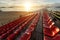 Empty plastic chairs at temporary grandstand stadium in Phuket,